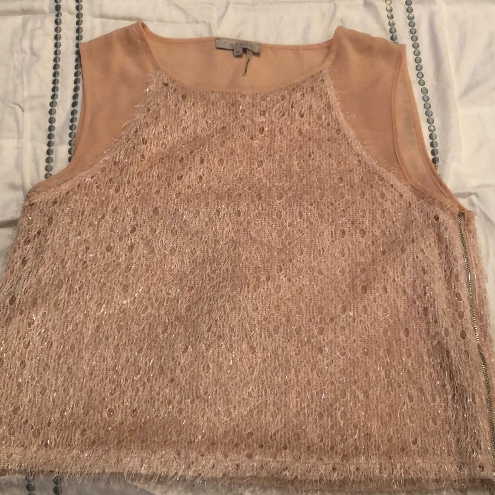 Fringe accented sleeveless blouse